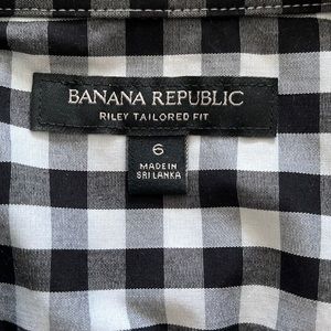 Woman’s long sleeve checkered white and black shirt